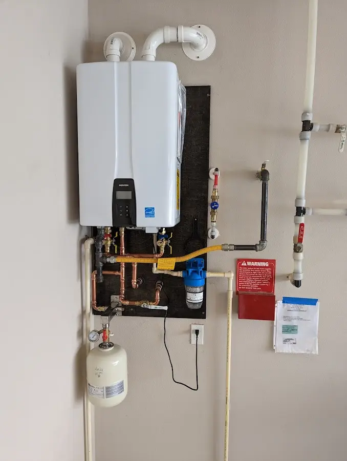 Professional plumber installing copper piping in a Ohio home